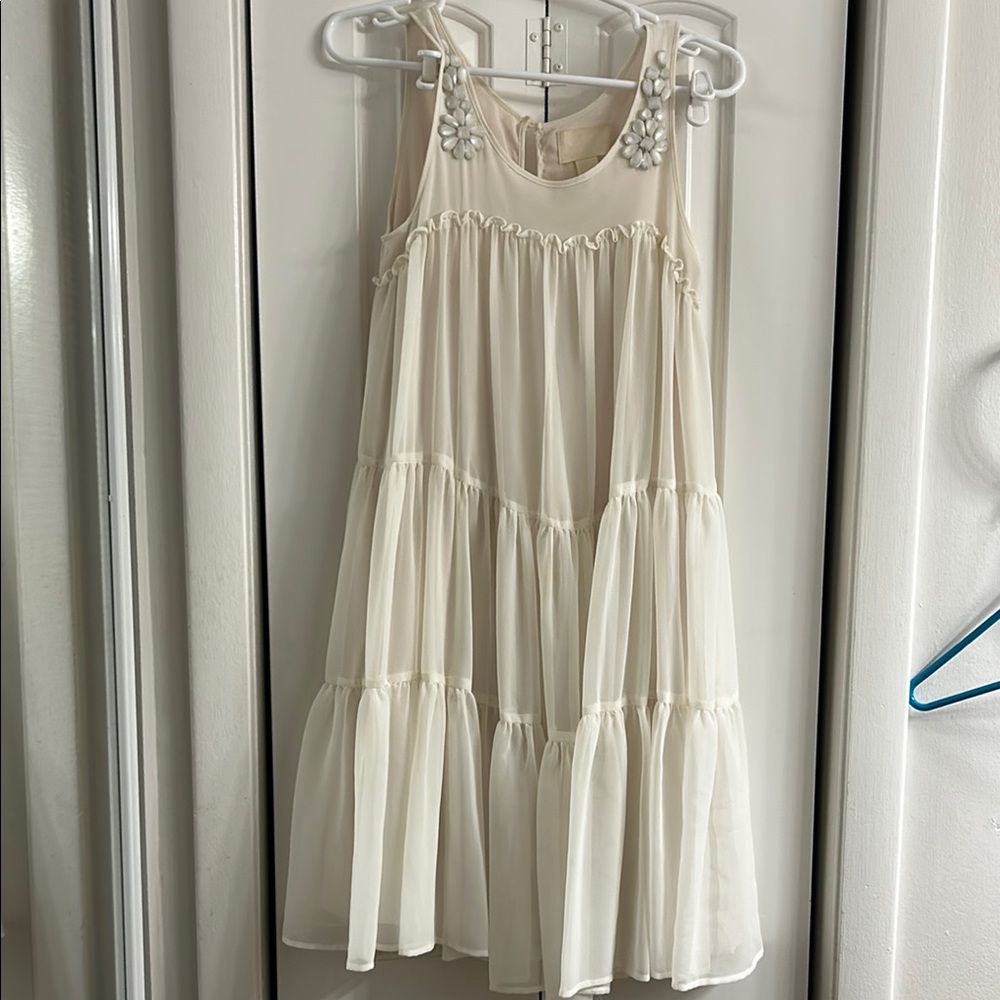 Elegant Cream Sleeveless Dress with Floral Accents